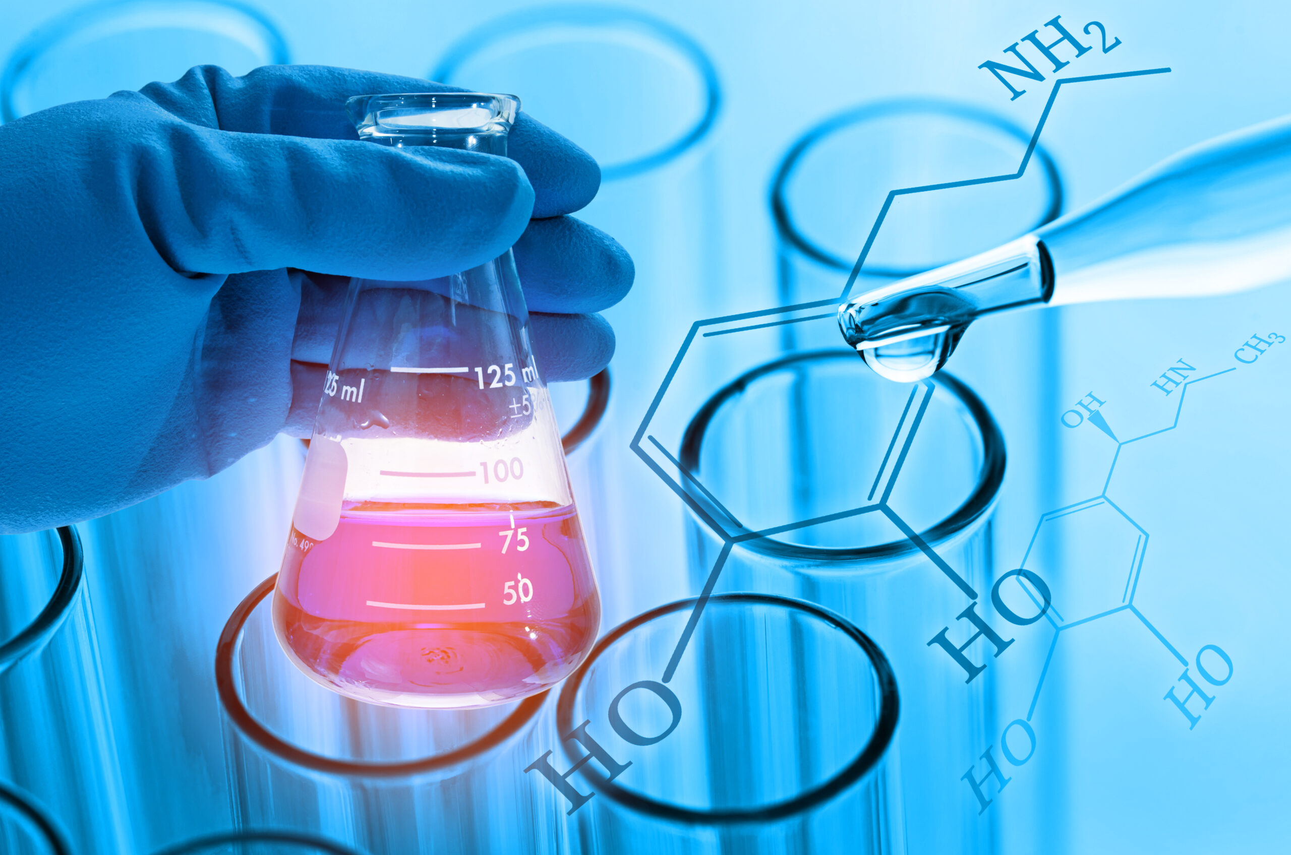 scientist hand holding laboratory flask with laboratory test tub